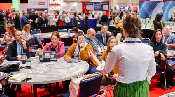 Ideas Xchange photo with moderator and discussion groups